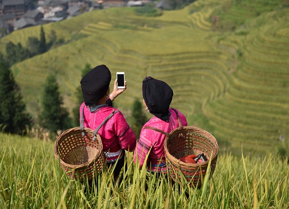 Girls taking photos on the Longji terraces